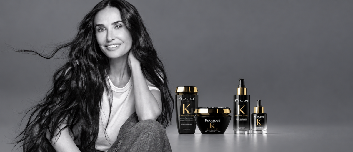 Kérastase Chronologiste collection with a monochrome portrait and four black and gold haircare products.