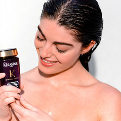 Kérastase Chronologiste Bain Régénérant Shampoo 250mL held in hand