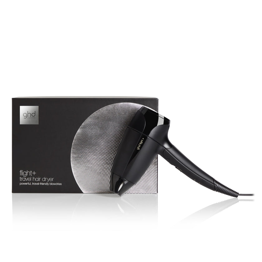 GHD Flight+ travel hair dryer with packaging on white background